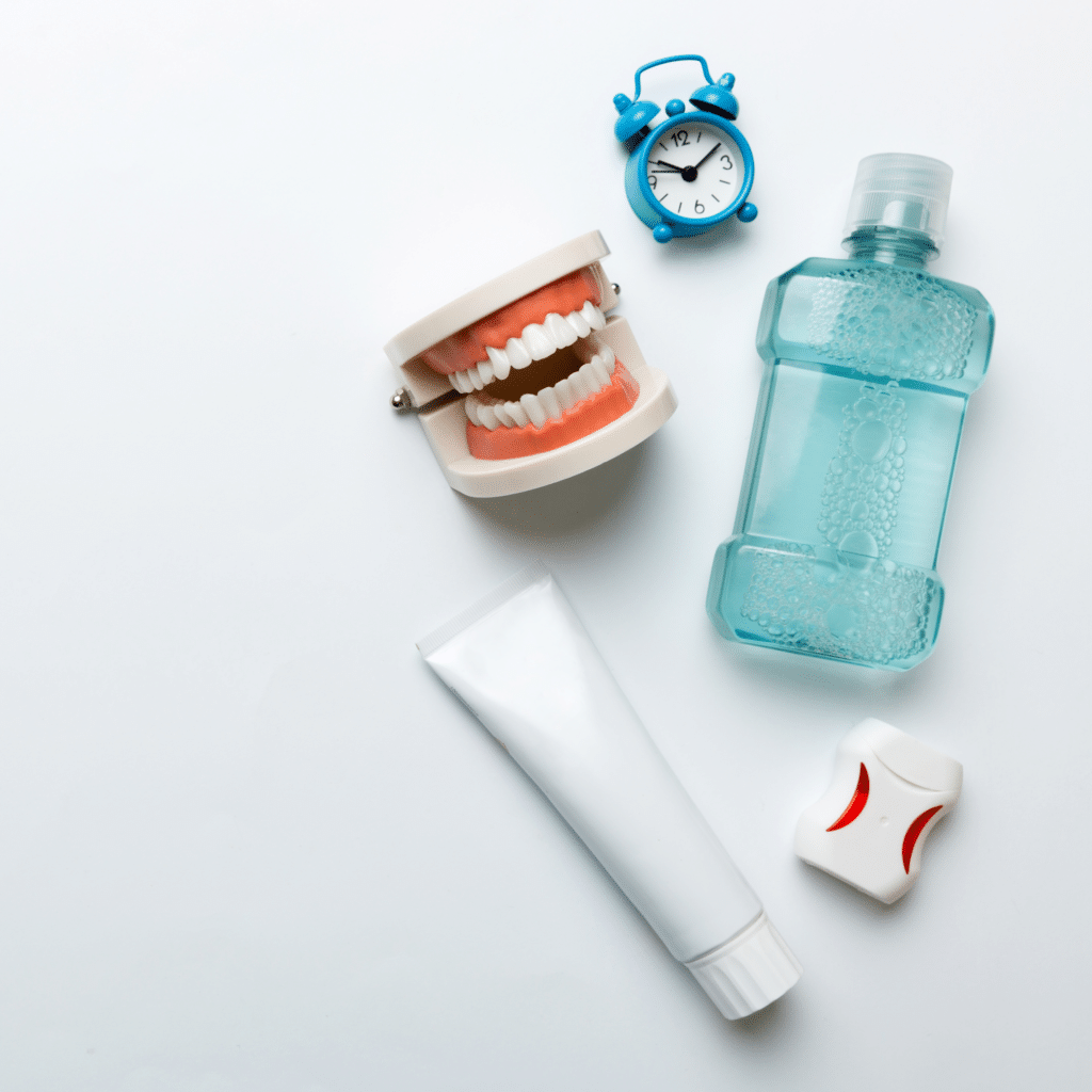 mouthwash other oral hygiene products colored table top view with copy space flat lay dental hygiene oral care kit dentist concept